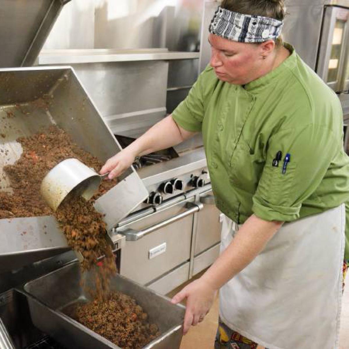 a school nutrition professional cooks sloppy joes