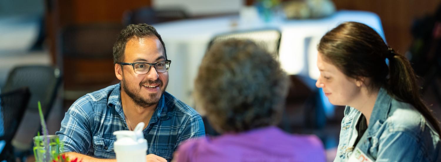 educators smile as they work together indoors